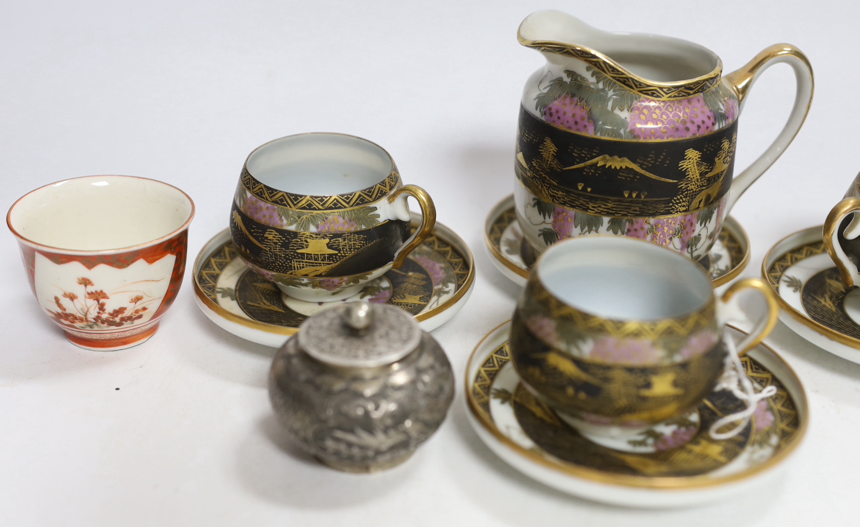 A Chinese white metal unsigned pot and cover, 5cm high, together with two Japanese Kutani tea bowls, 19th century and a Japanese egg shell part tea set